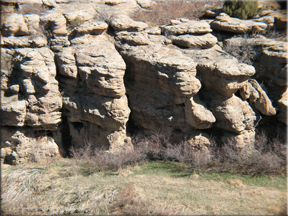 weathered rocks in the side of the canyon